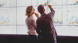 C2C cover men pointing at charts_0.jpg